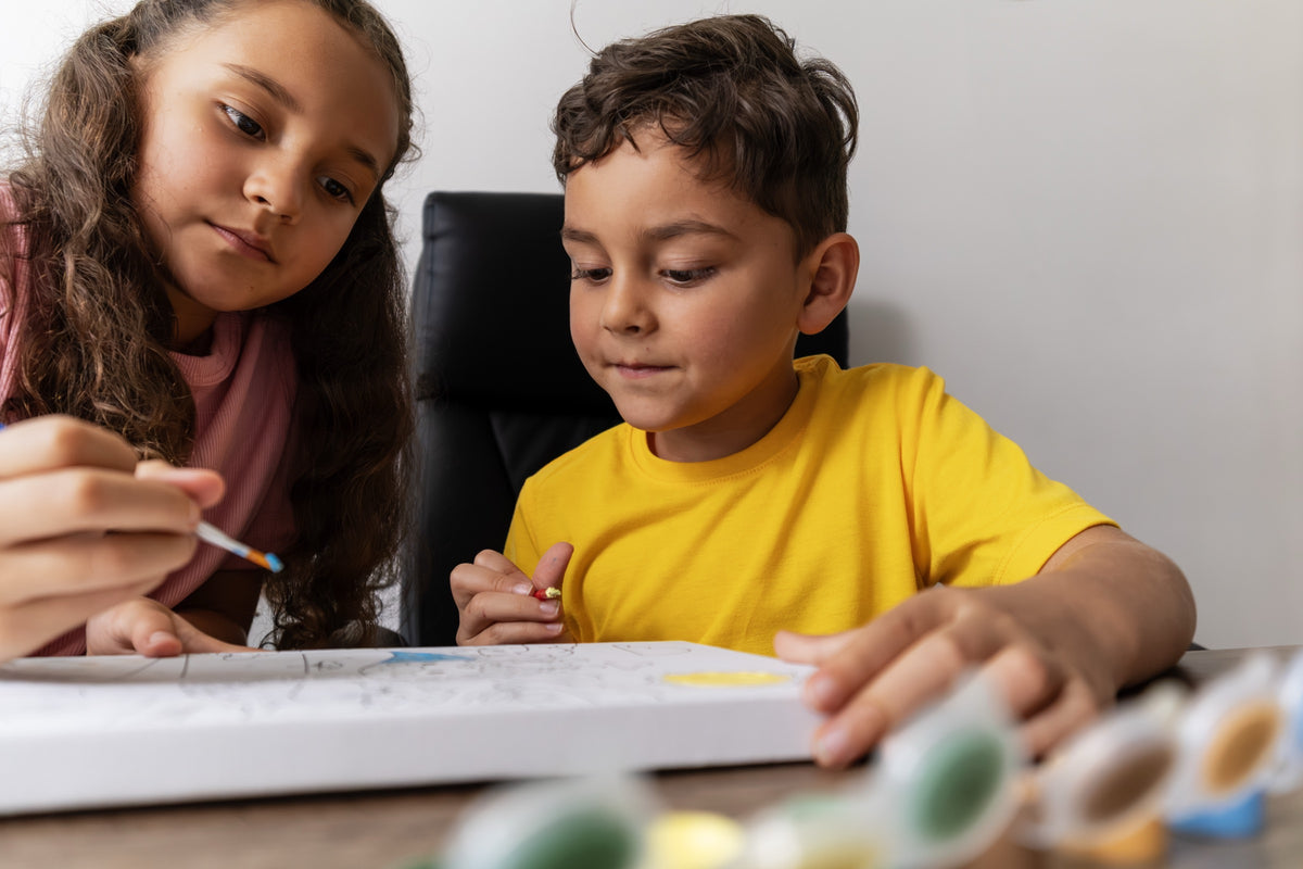 Homeschool children learning side by side at Hexagon Academy